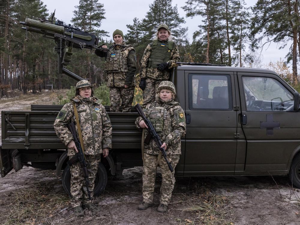 Inna (bottom left), Tetiana (top left), Olena (top right) and Valentyna (bottom right) pose for a portrait before training at their base outside Kyiv. The women are trained to shoot down Russian drones but they have also helped each other heal through the trauma and loss of war.