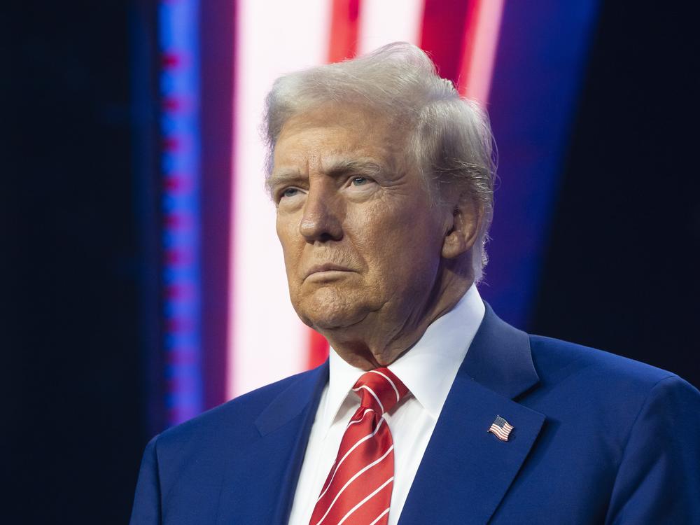 President-elect Donald Trump looks on during Turning Point USA's AmericaFest at the Phoenix Convention Center in December 2024 in Phoenix, Ariz.