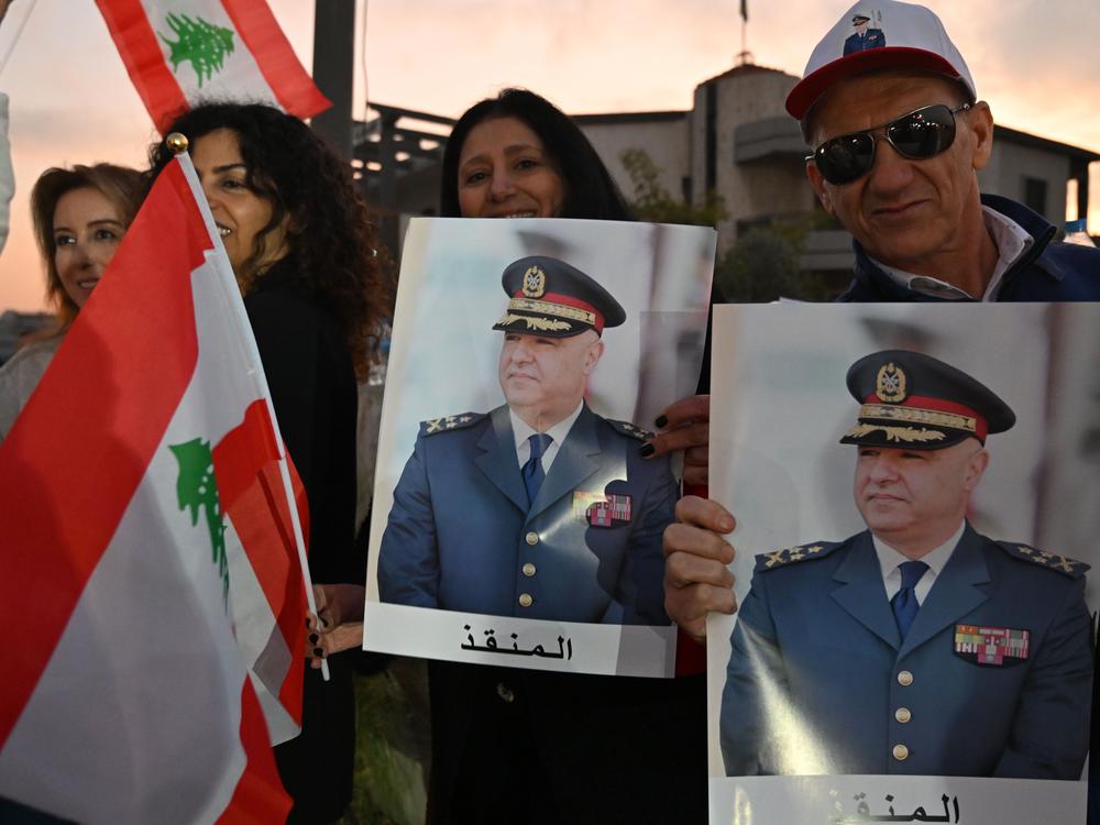 People gather to celebrate after Lebanese parliament elects army chief Joseph Aoun new president, on Thursday, in Beirut, Lebanon.