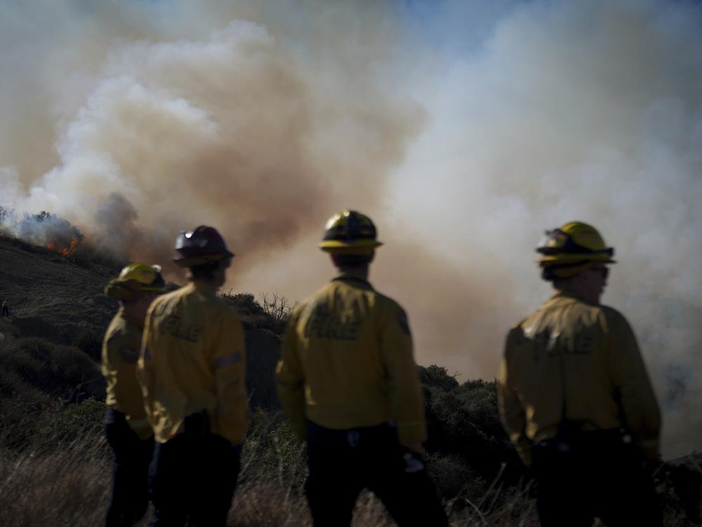 Friday. Jan. 10: Fire crews monitor the Palisades Fire in the outskirts of the Pacific Palisades neighborhood.