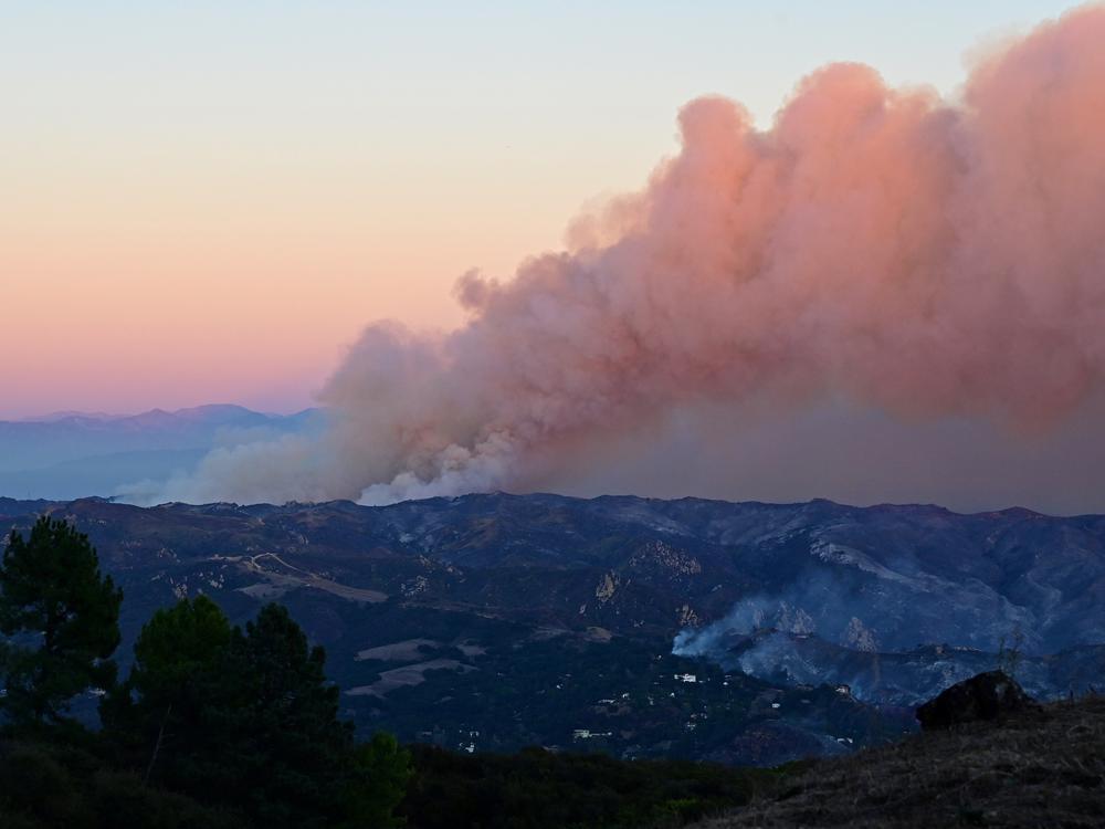 Friday, Jan. 10: Smoke billows from the Palisades fire as seen near Fernwood, Topanga, a community in western Los Angeles County.