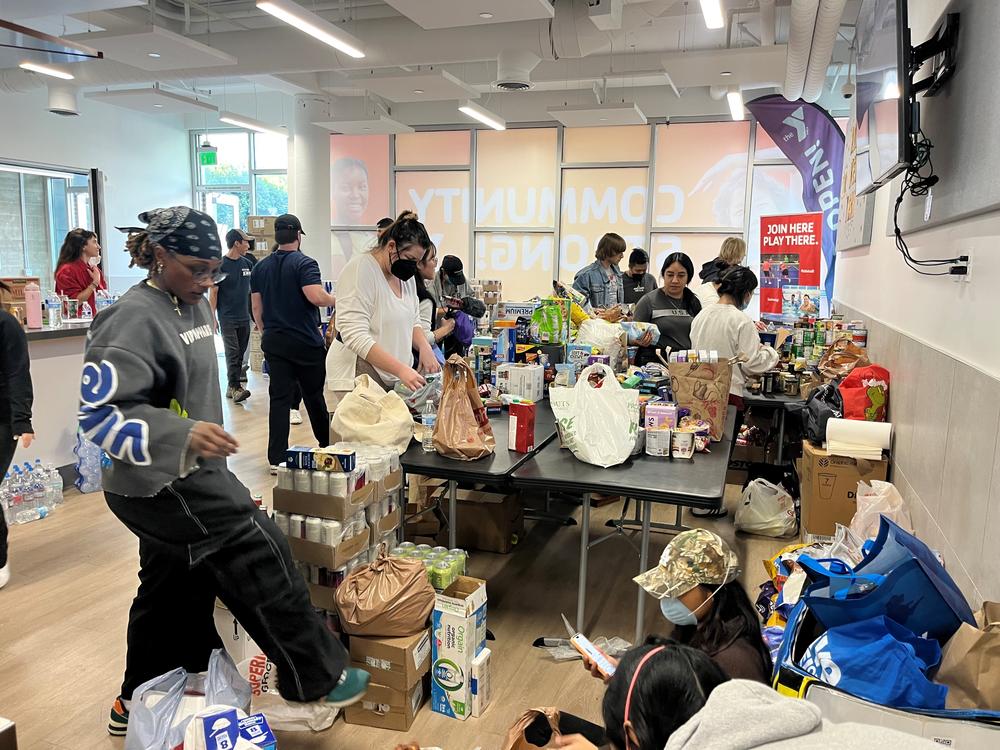 Volunteers from across Los Angeles are helping manage donations at the Anderson Munger Family YMCA, a central location for collecting and distributing donations to evacuees and first-responders.