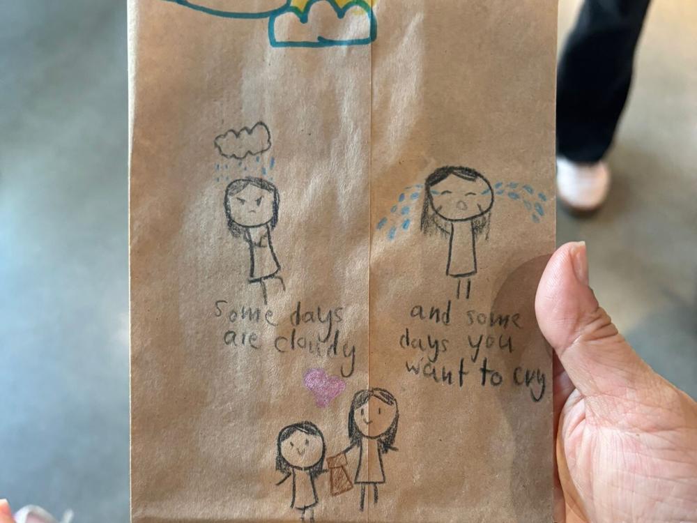 A child's drawing on brown paper lunch sacks prepared for Covenant House, after the nonprofit requested sandwiches from the LA community to feed the displaced young people it shelters.