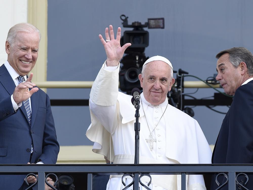 Pope Francis, flanked by Vice President Joe Biden and House Speaker John Boehner of Ohio, waves to the crowd on Capitol Hill in Washington as they stand on the Speaker's Balcony on Capitol Hill, after the pope addressed a joint meeting of Congress in September 2015.