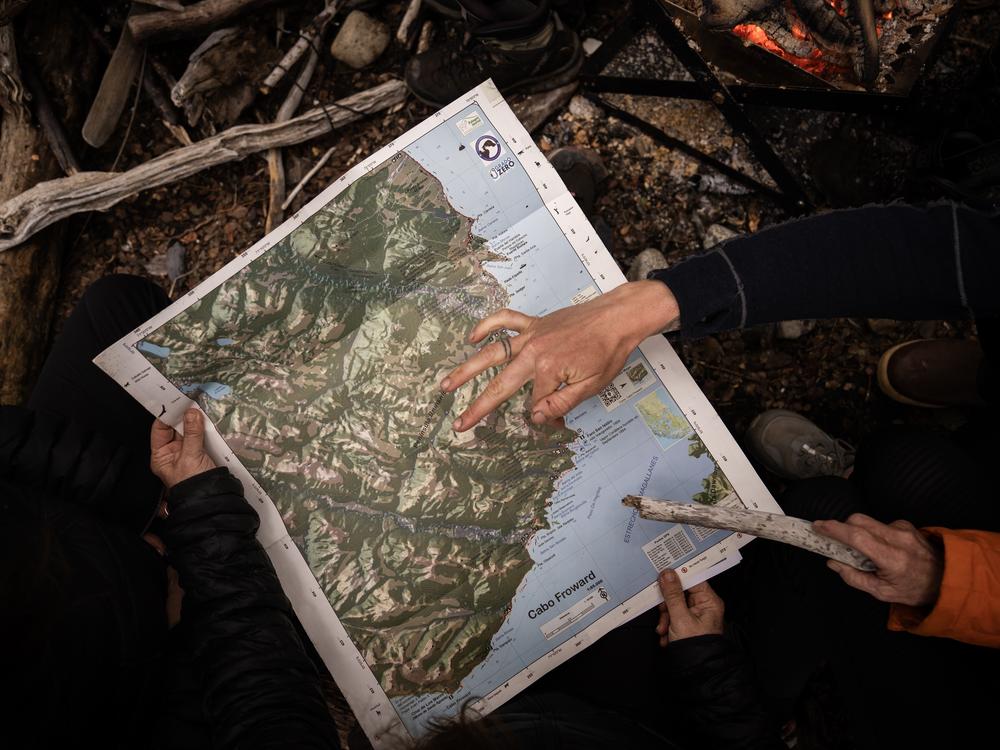 Kristine Tompkins, founder of Tompkins Conservation, and her team analyze the map of the future Cape Froward National Park in order to make decisions on where certain facilities should be located and which areas should remain protected in Patagonia, Chile, on Nov. 3, 2024.
