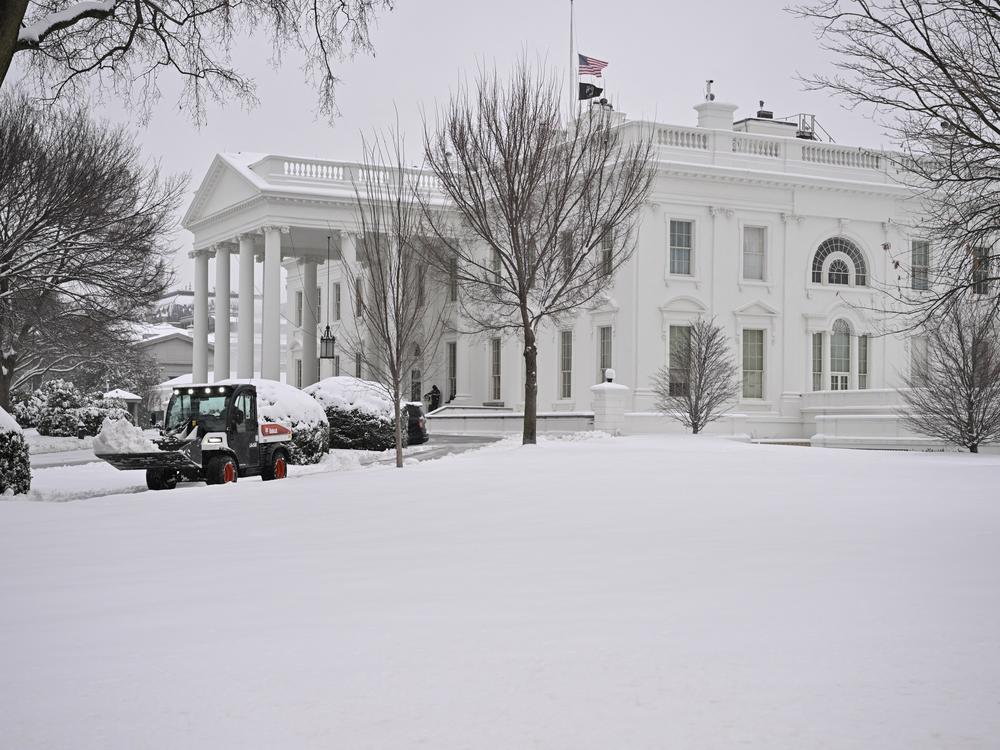 Workers remove snow from a sidewalk at the White House this month. A massive storm system dumped heavy snow and freezing rain on large swaths of the eastern United States, bringing an unusual amount to snow to the region.