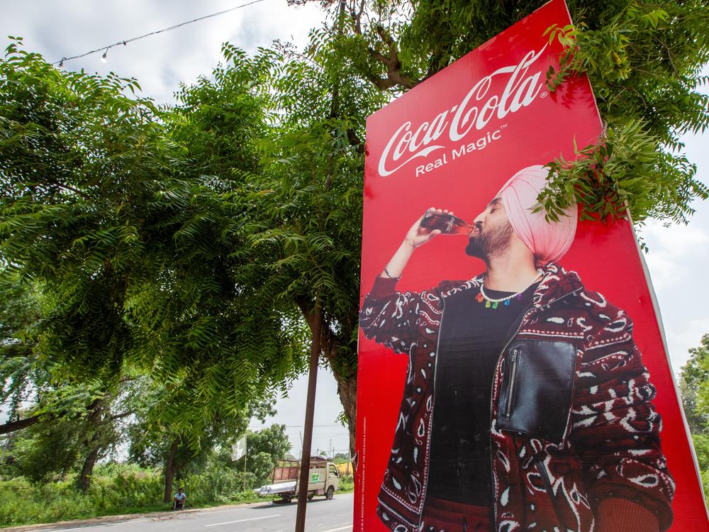 An advertisement of a soft drink brand featuring a local music star in Mansa district, Punjab, India, on Tuesday, Aug. 8, 2023.