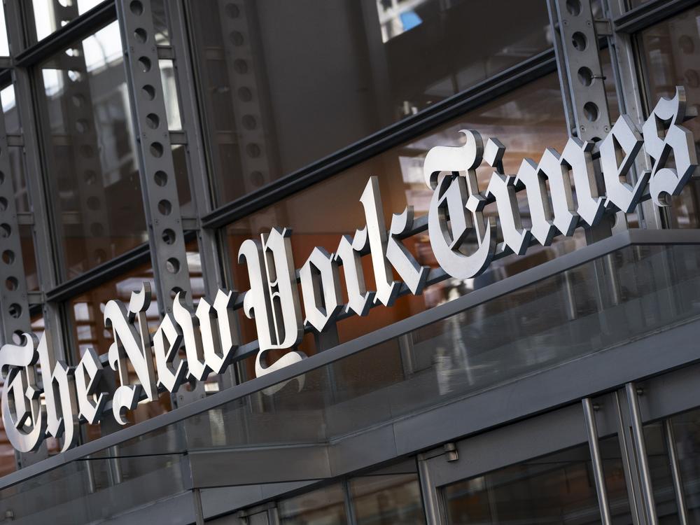 A sign for The New York Times hangs above the entrance to its building, Thursday, May 6, 2021, in New York.  The New York Times filed a federal lawsuit against OpenAI and Microsoft on Wednesday, Dec. 27, 2023, seeking to end the practice of using published material to train chatbots.