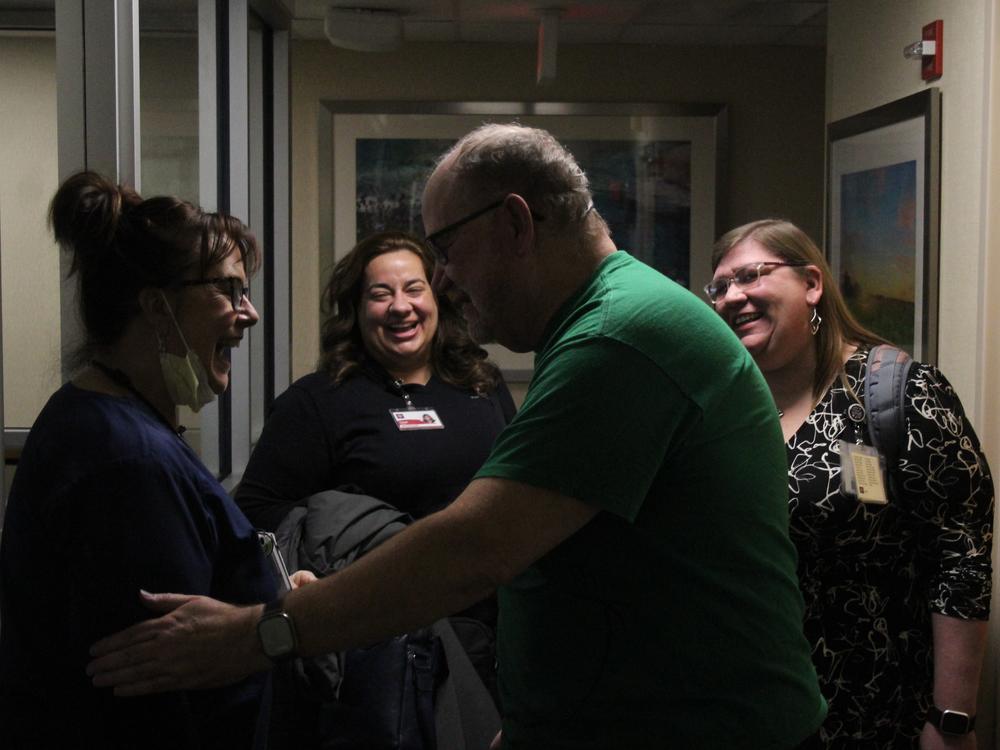 Timothy Moss (right center) was part of a program out of the Indiana University Health system, which connects hospital patients with 