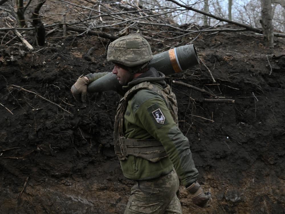 An artilleryman of the Ukrainian armed forces prepares to fire a French-made Caesar self-propelled howitzer toward Russian positions in the Donetsk region on Jan. 6.