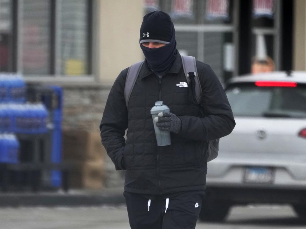 A pedestrian bundles up as he walks on the street during cold weather in Chicago on Jan. 8.