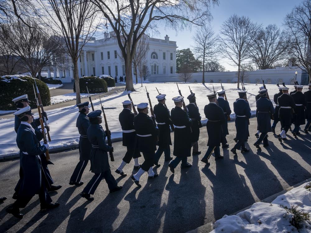 Members of the U.S. military Joint Honor Guard parade as they rehearse ahead of the upcoming presidential inauguration, at the North Lawn in front of the White House in Washington on Jan. 12.