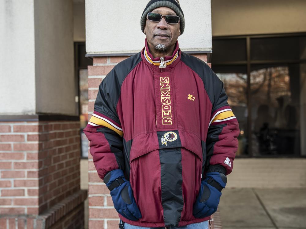 Ted Wiles stood in line for hours on a frigid, blustery day to get free groceries at No Limits. He started coming a few years ago, when food prices skyrocketed, and says it helps him make ends meet.