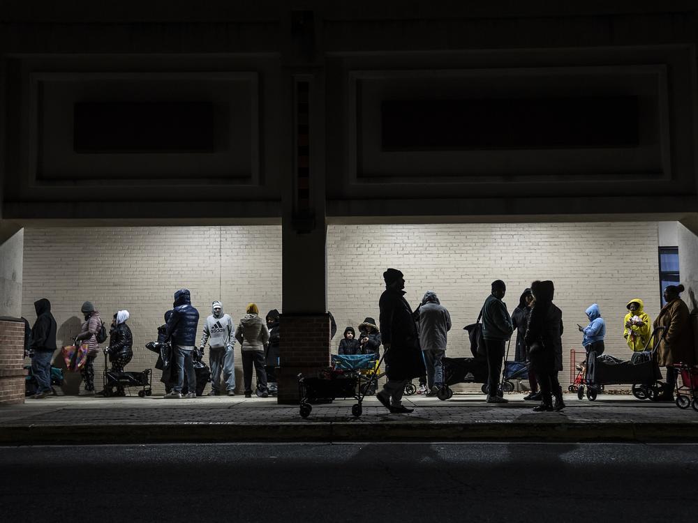 At the No Limits food pantry in Landover, Md., the line of people waiting to get in on Dec. 6, 2024, stretches to the street and down the block.
