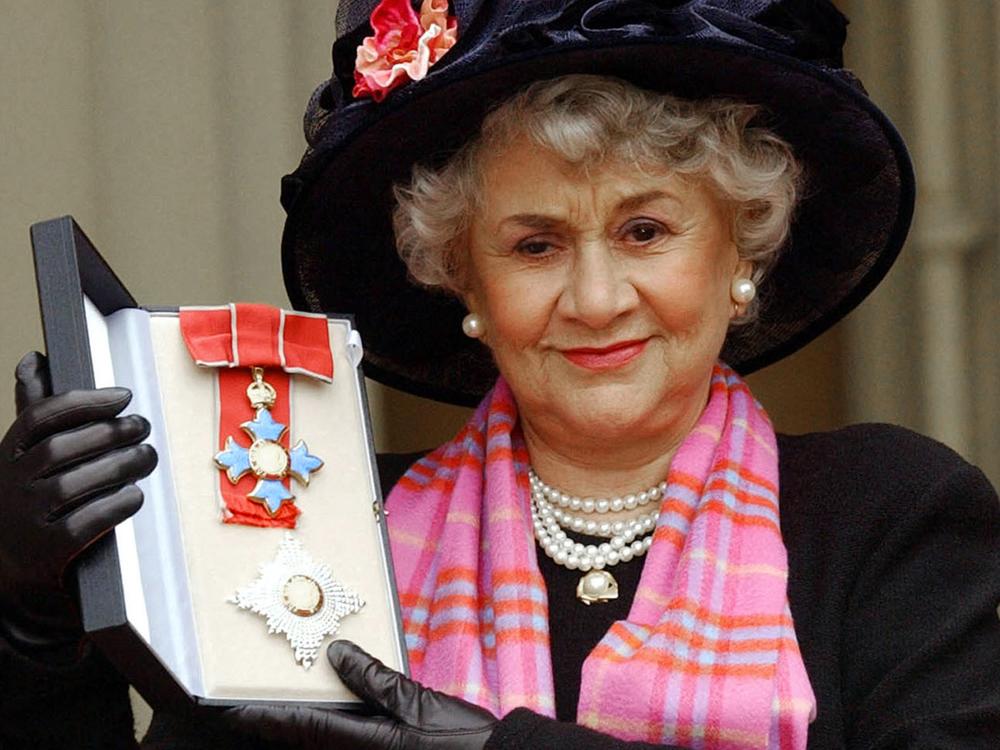 Plowright poses for pictures after being made a Dame by the Prince of Wales at Buckingham Palace in London in February 2004.