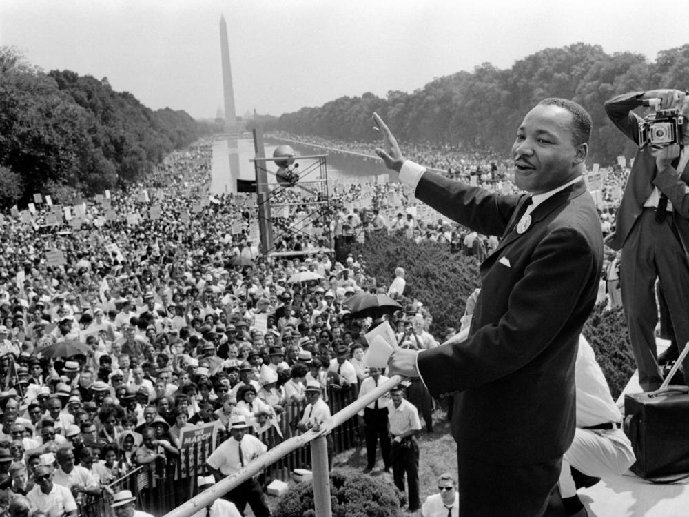 Dr. Martin Luther King waves to supporters on Aug. 28, 1963, on the National Mall during the March on Washington, where King delivered his famous 