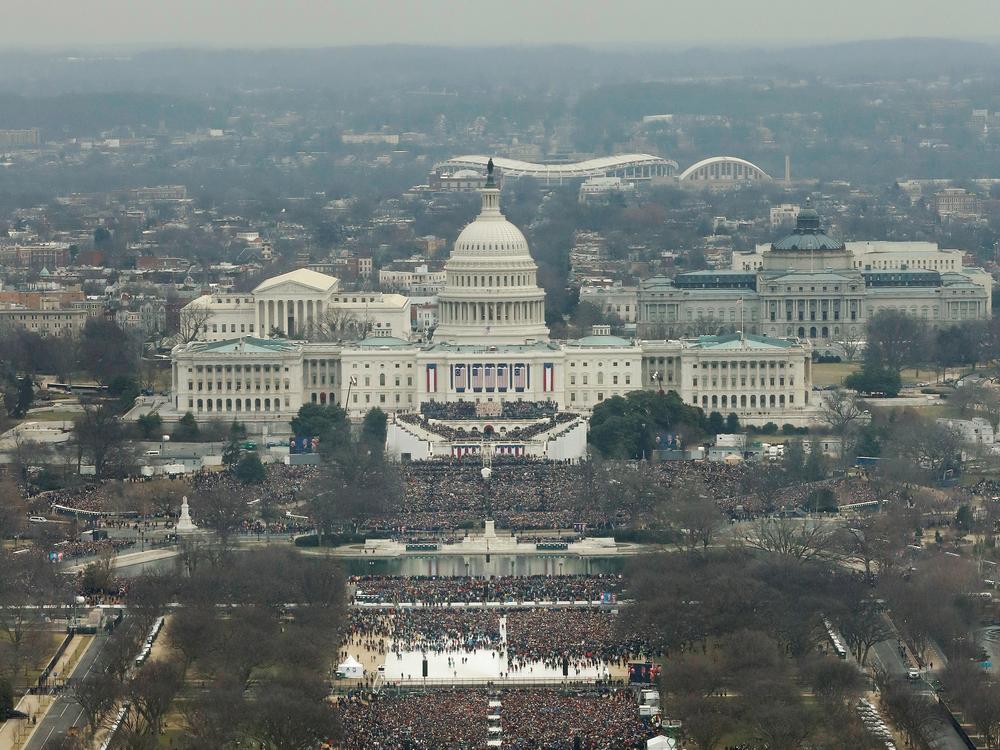Attendees line the National Mall as they watch ceremonies to swear in Donald Trump on Inauguration Day on Jan. 20, 2017.