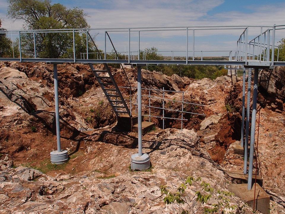 The Sterkfontein excavation site in South Africa, showing red sediments that contained <em>Australopithecus</em> fossils that were used in this study to recreate their ancient diet.