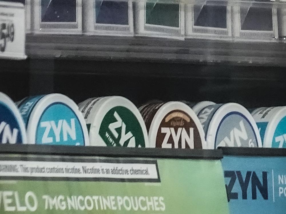 Containers of Zyn, a smokeless nicotine pouch, are displayed for sale among other nicotine and tobacco products at a newsstand in New York on Feb. 23, 2024.