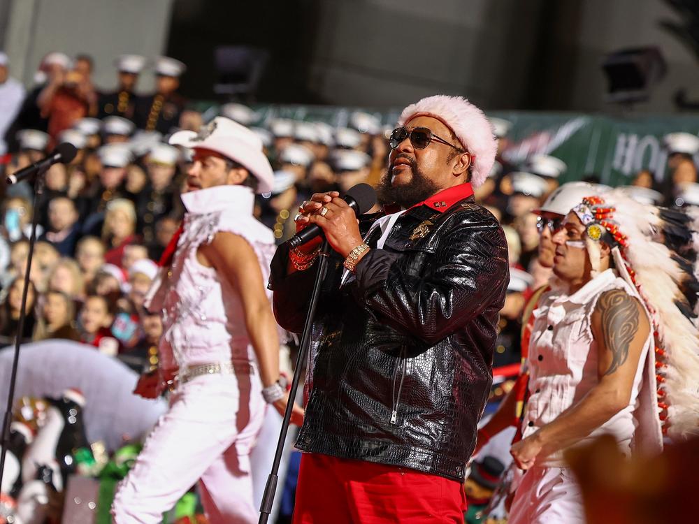 Victor Willis (center), the only surviving original member of Village People, performs during the 91st anniversary of the Hollywood Christmas Parade.