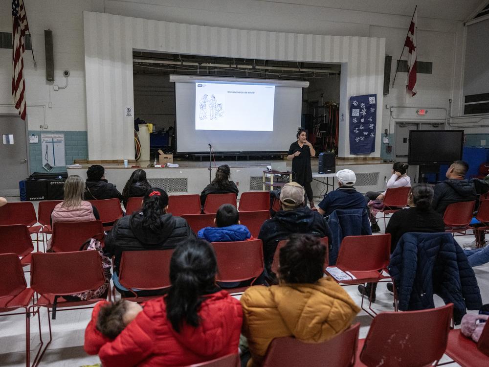 Amica Center for Immigrant Rights (formerly known as CAIR Coalition) attorney, Atenas Burrola Estrada speaks during an presentation on immigration enforcement at a school in Washington, DC on January 10, 2025.