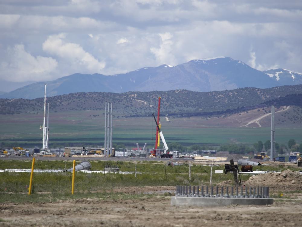 Workers build an electrical substation for a new Facebook data center under construction on May 29, 2019 in Eagle Mountain, Utah.