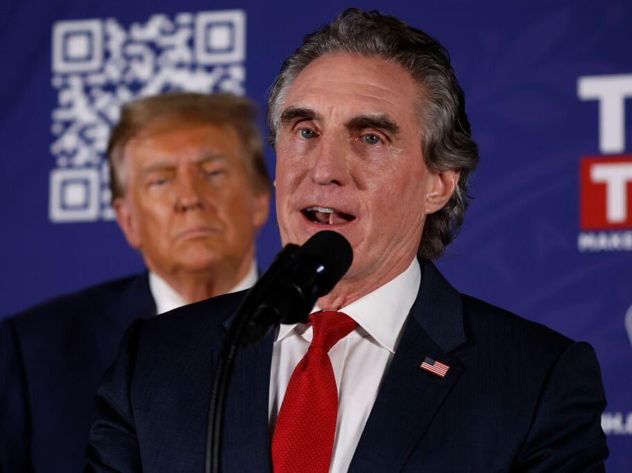 Doug Burgum encourages voters to support Donald Trump during a campaign rally in January 2024 in Laconia, N.H. Burgum ran against Trump for the Republican presidential nomination but later dropped out and endorsed him.