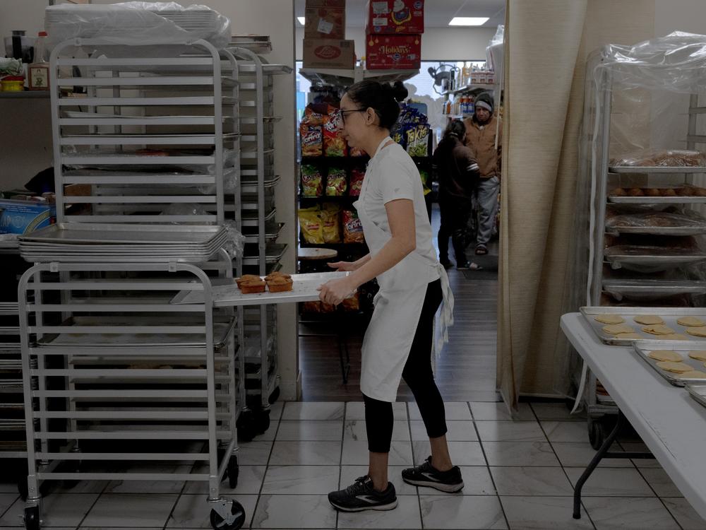 Alma Salas, originally from Mexico, prepares pastries last month at Mamá Chencha Tienda y Panaderia in Fremont, Neb.