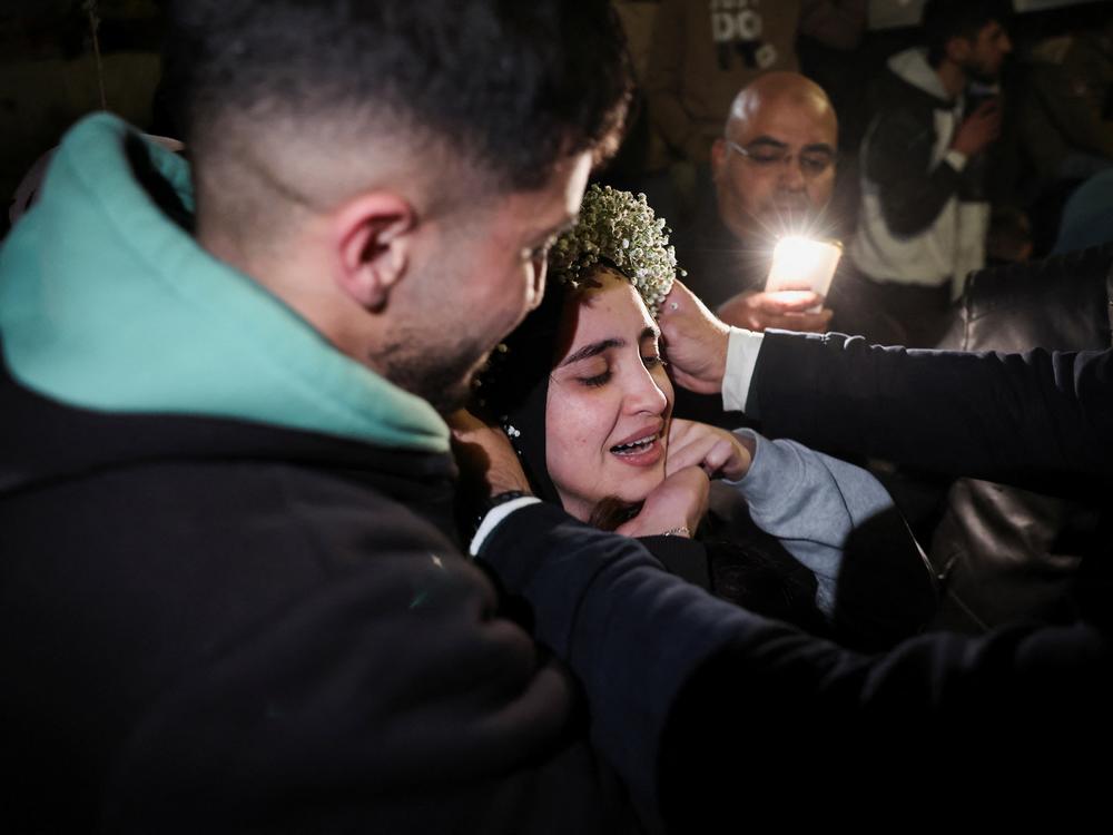 A freed Palestinian prisoner is greeted after their release from an Israeli jail as part of a hostages-prisoners swap and a ceasefire deal in Gaza between Hamas and Israel, in Ramallah, in the Israeli-occupied West Bank Jan. 20, 2025.