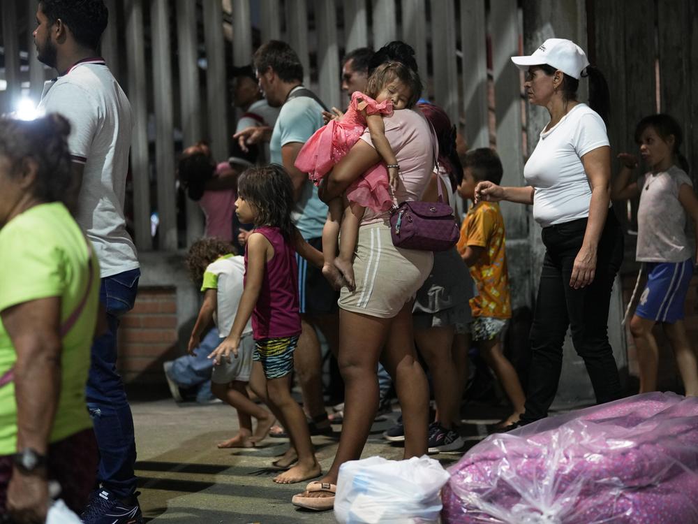 People displaced by violence in towns across the Catatumbo region, where rebels of the National Liberation Army, or ELN, have been clashing with former members of the Revolutionary Armed Forces of Colombia, arrive for shelter at a soccer stadium in Cúcuta, Colombia, on Sunday.