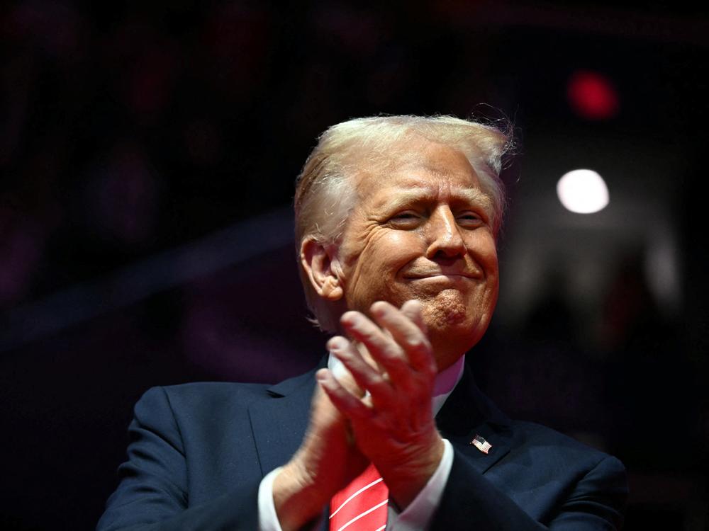 U.S. President-elect Donald Trump reacts during a MAGA victory rally at Capital One Arena in Washington, DC on Sunday, one day ahead of his inauguration ceremony.