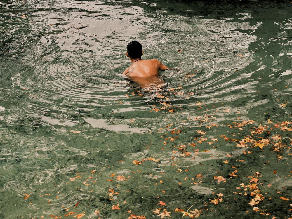 Swimmers enjoy the fresh water of the Rock Springs swimming hole on Dec. 11, at Rock Springs in Apopka, Fla.