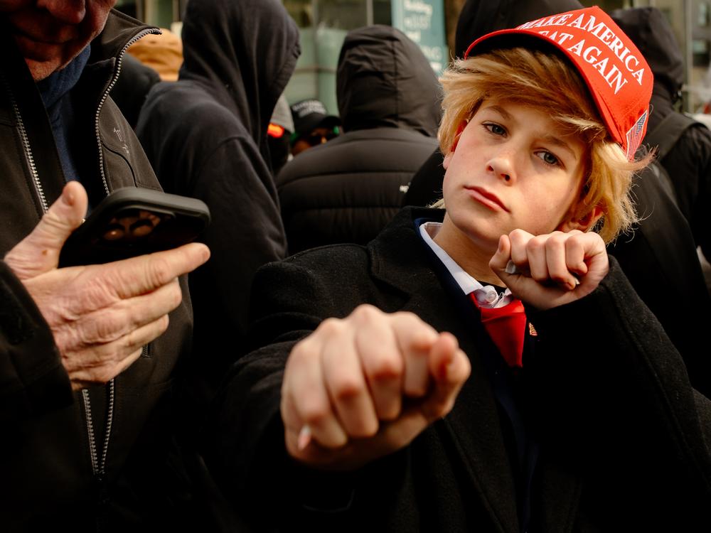 A young Donald Trump supporter dresses up as the president on Monday, Jan. 20, 2025, — the day of his second inauguration — in Washington D.C.