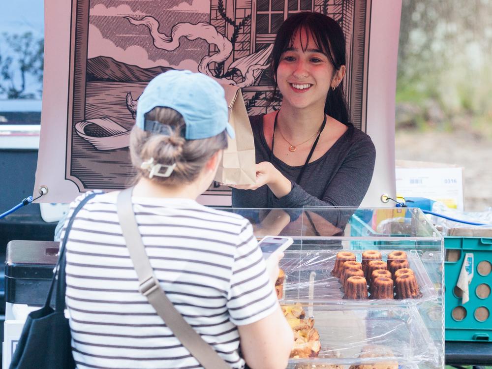 Davis began selling baked goods at a farmer's market to make extra money, and she says that helped her get through community college. Here Davis sells her goods at a market in Bryan Park in Richmond.