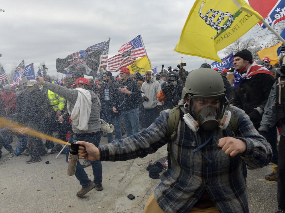 Trump supporters clash with police and security forces as people try to storm the US Capitol Building in Washington, DC, on January 6, 2021.