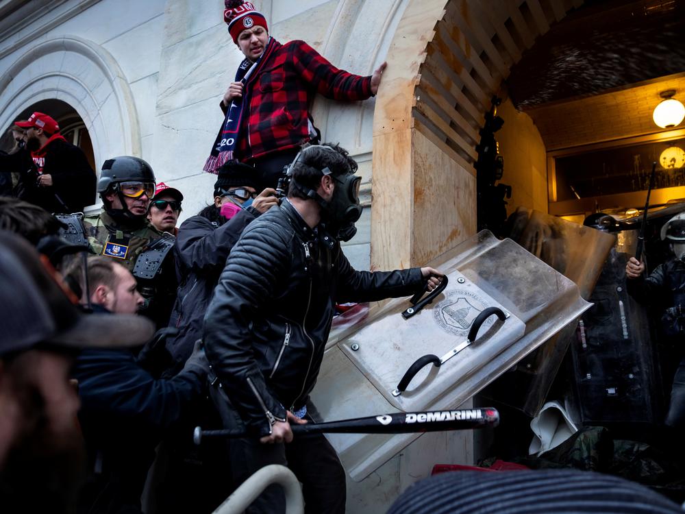 Trump supporters clash with police and security forces as people try to storm the US Capitol on January 6, 2021 in Washington, D.C.