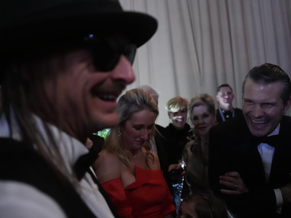 Kid Rock talks with defense secretary nominee Pete Hegseth at the Commander-in-Chief Ball on Monday.