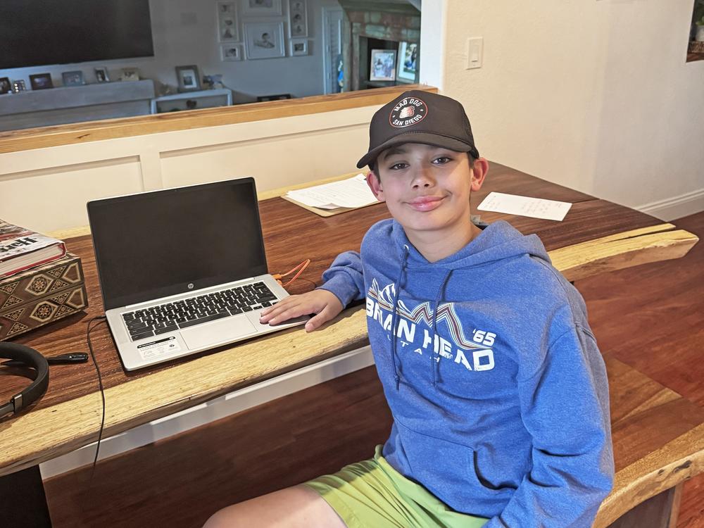 <em>Cian sits for a portrait at his home in Carlsbad, Calif. His friend and fellow Magnolia student journalist, Eivan Wheyland, took the photos.</em>