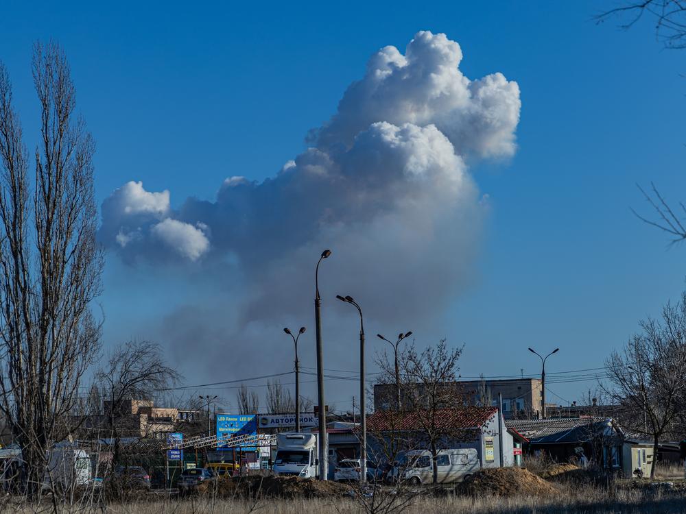 A cloud of smoke rises above Kherson after another explosion. The city faces constant shelling by Russian artillery, as well as bombs dropped by drones.