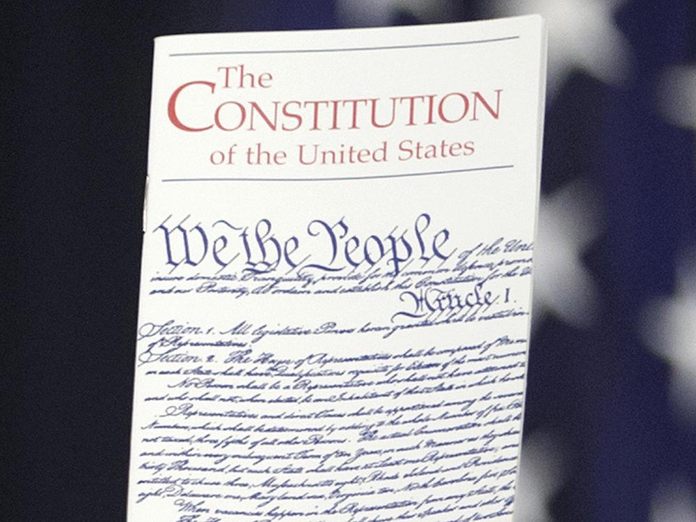 The Constitution is held by a member of Congress on Capitol Hill in Washington on March 23, 2016.