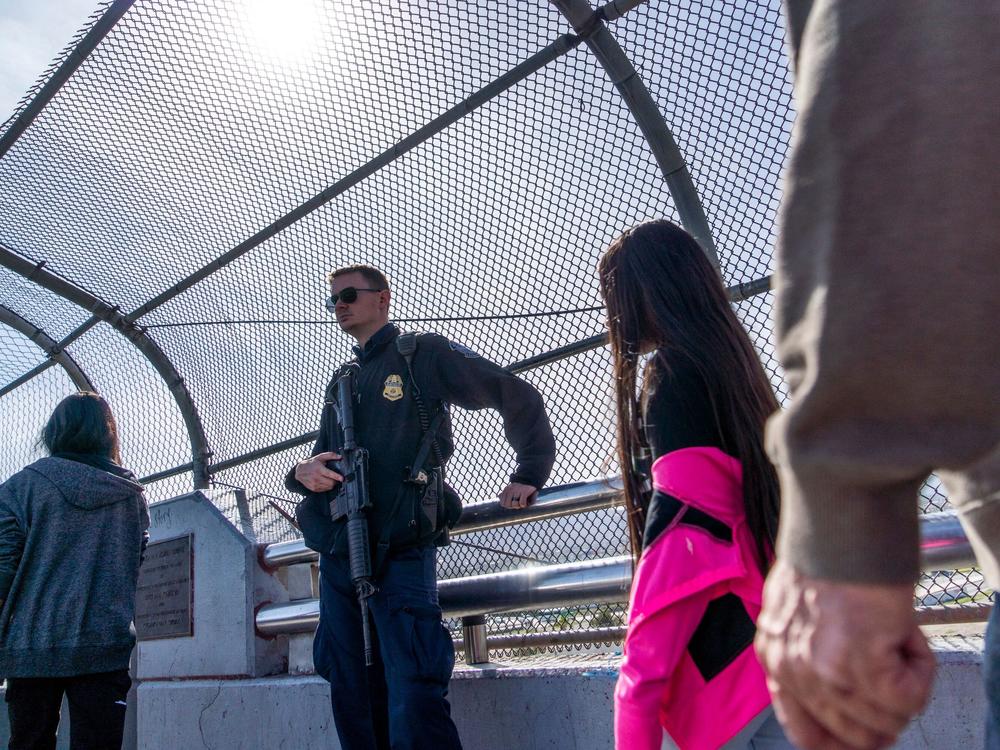 A Customs and Border Protection officer guards the middle of the Paso Del Norte bridge in El Paso, Texas, on Nov. 4, 2018.
