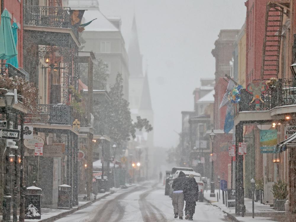 New Orleans, Louisiana: Snow falls on Chartres Street in the French Quarter.