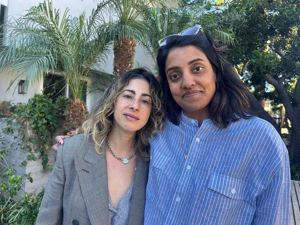Erica Fishman, left, and Meera Menon, right, are longtime friends. Both lost their homes in Altadena this month. They're heading to Sundance Film Festival to premiere their zombie film called <em>Didn't Die</em>.