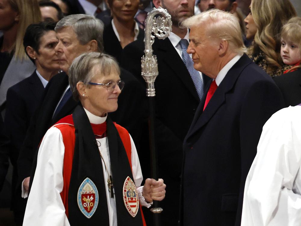 Bishop Mariann Edgar Budde (left) arrives as President Trump looks on during the National Prayer Service at Washington National Cathedral on Jan. 21 in Washington, D.C.