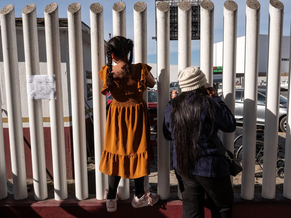 Asylum-seekers wait for news on the CBP One appointments at El Chaparral crossing port in Tijuana, Baja California state, Mexico, on Tuesday.
