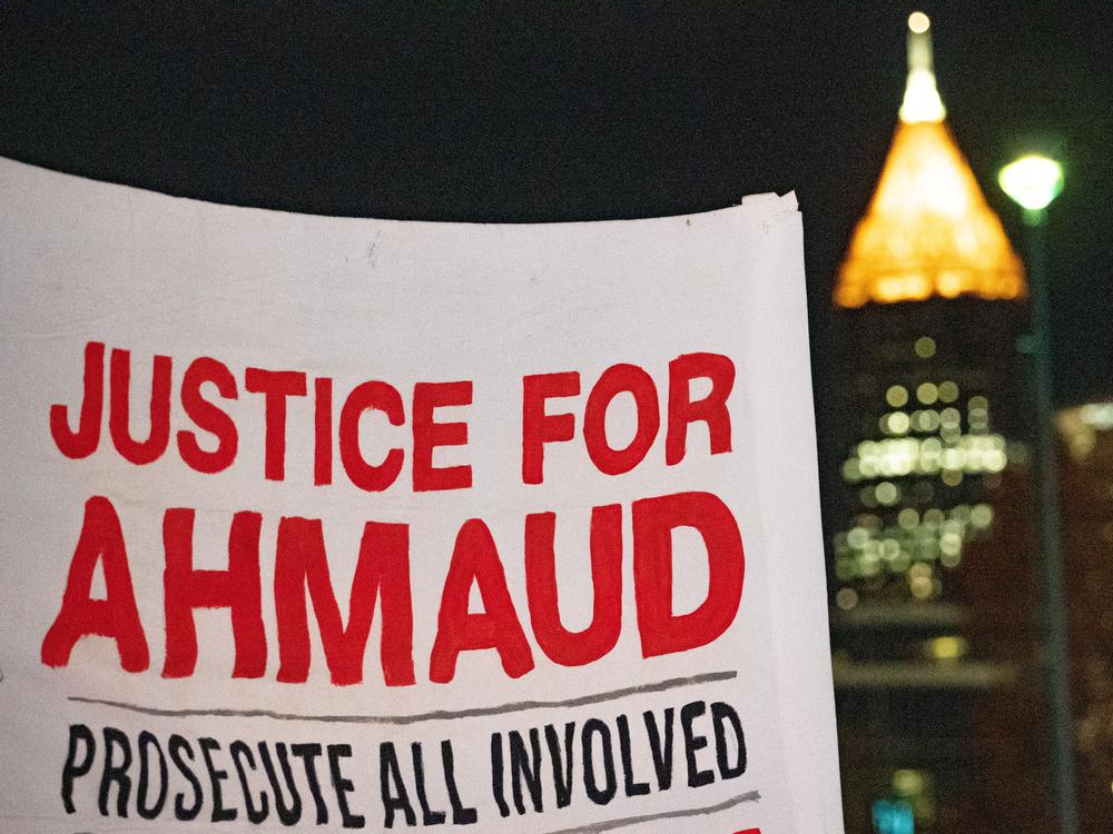 People participate in a demonstration in Atlanta following the guilty verdicts in the trial of the killers of Ahmaud Arbery on Nov. 24, 2021. Greg McMichael, his son Travis McMichael, and a neighbor, William 