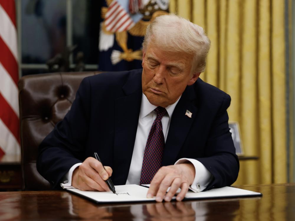 President Trump signs executive actions and orders in the Oval Office of the White House on Monday, hours after taking office for his second term as the 47th president of the United States.