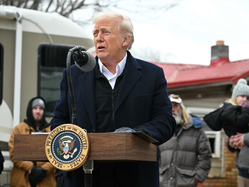 President Trump gets a briefing from officials in North Carolina about the recovery from Hurricane Helene in a hangar in Asheville, N.C. on Jan. 24, 2025.