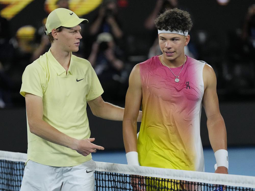 Jannik Sinner, left, of Italy is congratulated by Ben Shelton of the U.S., following their semifinal match at the Australian Open tennis championship in Melbourne, Australia, Friday, Jan. 24, 2025.