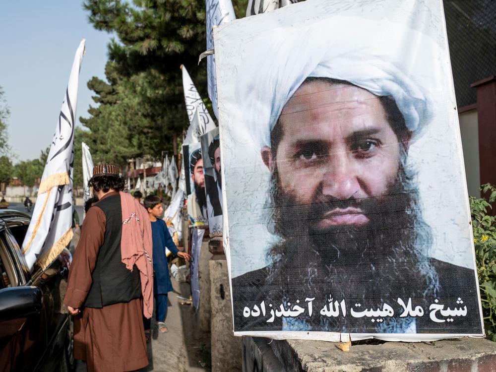 A poster of Taliban Supreme Leader Hibatullah Akhundzada is seen along a road in Kabul. He is one of two leaders named in proposed arrest warrants for their treatment of girls and women since taking power in 2021.